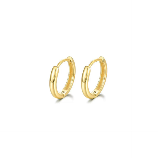 Gold hoop earrings on a white background