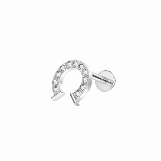 Silver hourseshoe labret stud , flat back earring with clear cubic zirconia gemstones on a white background
