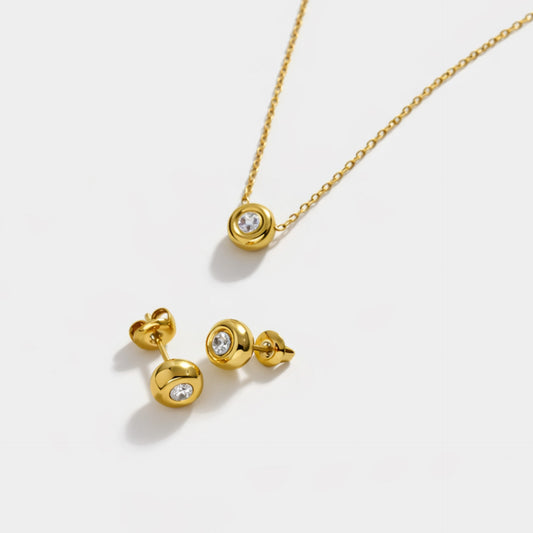 stainless steel pvd gold dainty necklace with a circle cz stone and matching stud earrings