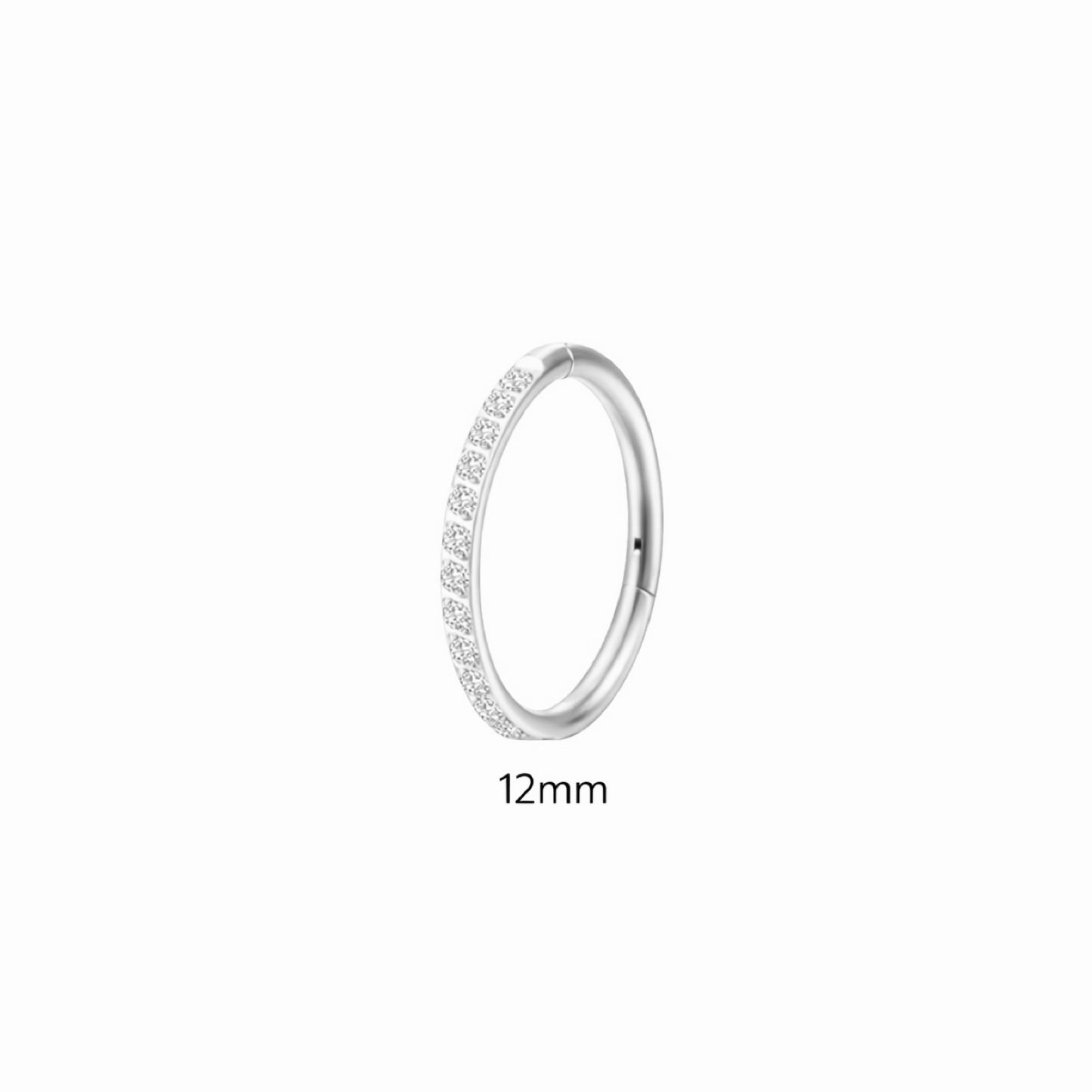 Silver ring with small stones on a white background