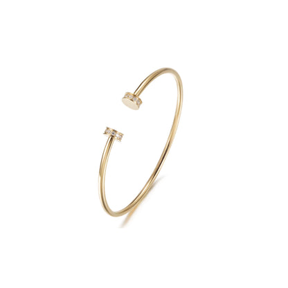 Gold bracelet with small diamonds on a white background