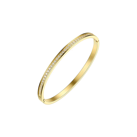 A slim gold bangle bracelet with a row of small clear stones set along the front edge, shown on a plain white background.