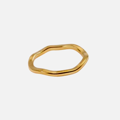 A gold thin irregular wave ring 