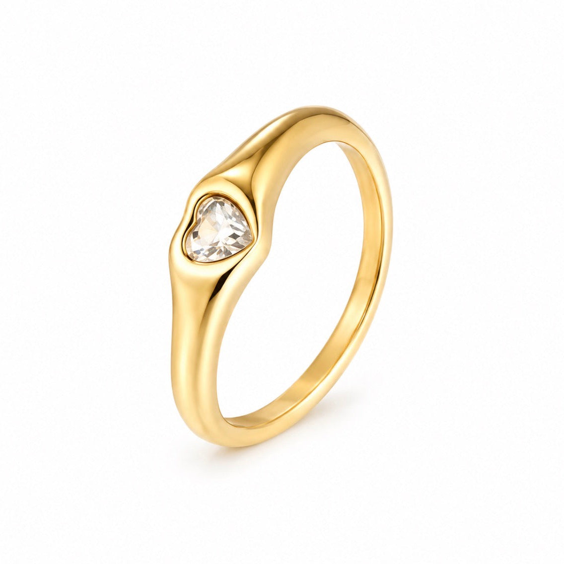 A yellow gold ring with a heart-shaped clear gemstone in a bezel setting, shown on a plain white background.