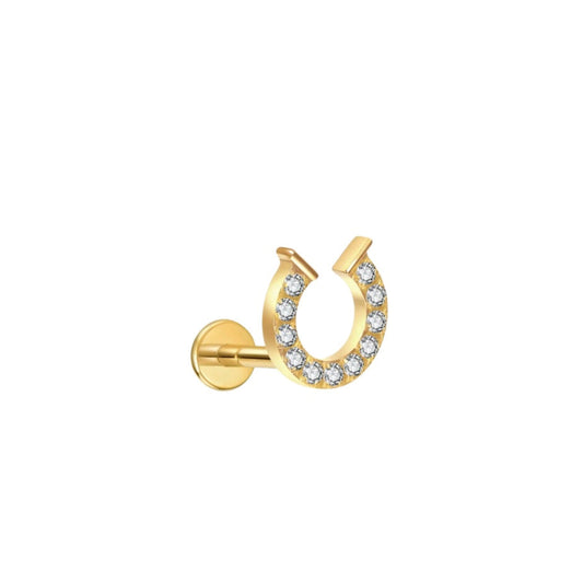Gold horseshoe-shaped labret stud. flat back stud earring  with clear stones on a white background 