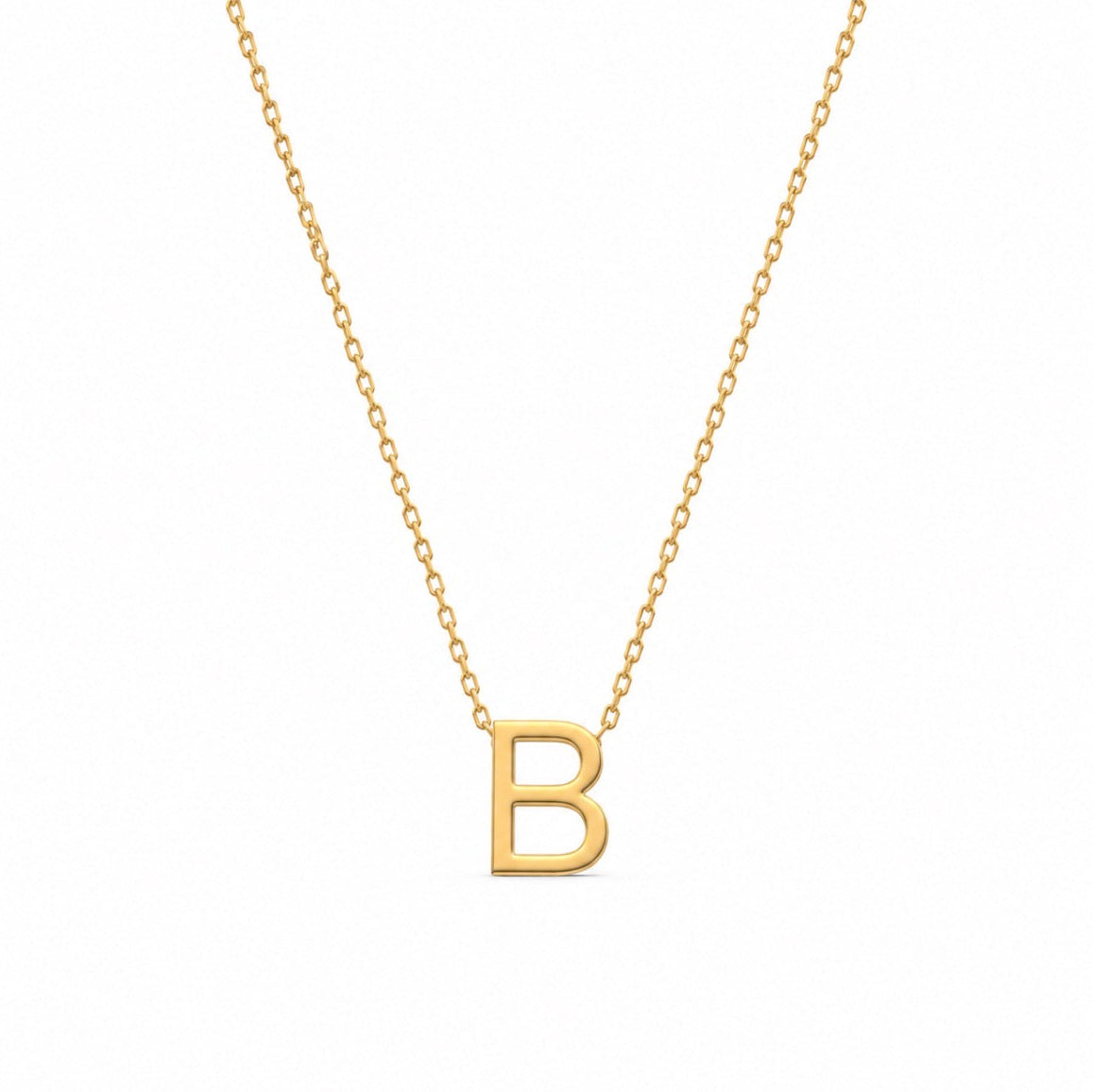 A gold initial necklace featuring a polished capital letter 'B' pendant on a delicate gold cable chain, shown against a plain white background.