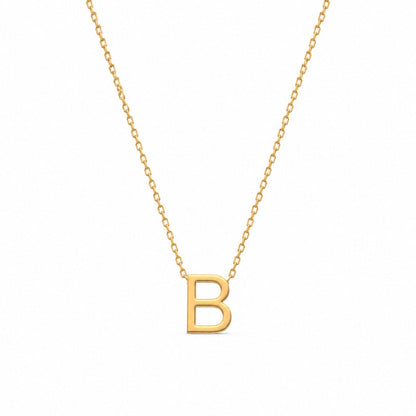 A gold initial necklace featuring a polished capital letter 'B' pendant on a delicate gold cable chain, shown against a plain white background.