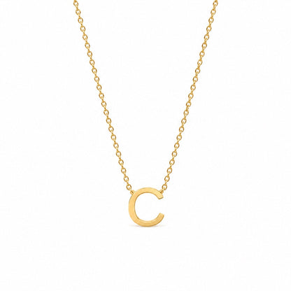 A delicate gold chain necklace featuring a polished, open circular letter 'C' pendant, presented on a clean white background.