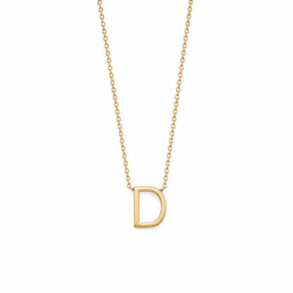A delicate gold chain necklace featuring a polished, open capital letter 'D' pendant, shown against a solid white background.