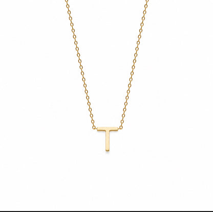 A delicate gold chain necklace featuring a small, polished capital letter 'T' pendant, shown against a plain white background.
