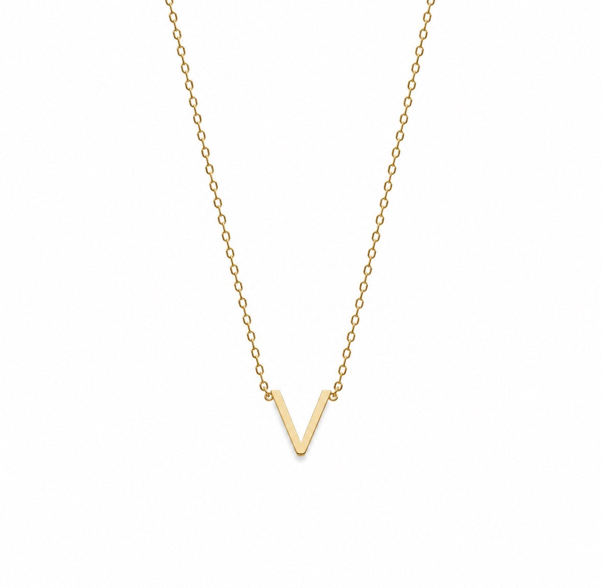 A delicate gold chain necklace featuring a small, polished gold letter 'V' pendant, presented on a clean white background.