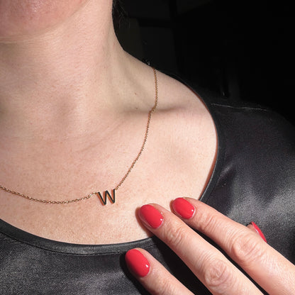 initial W necklace shown worn on model 