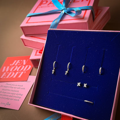 Jewelry set in a blue box with pink packaging and 'Jen Wood Edit' card.