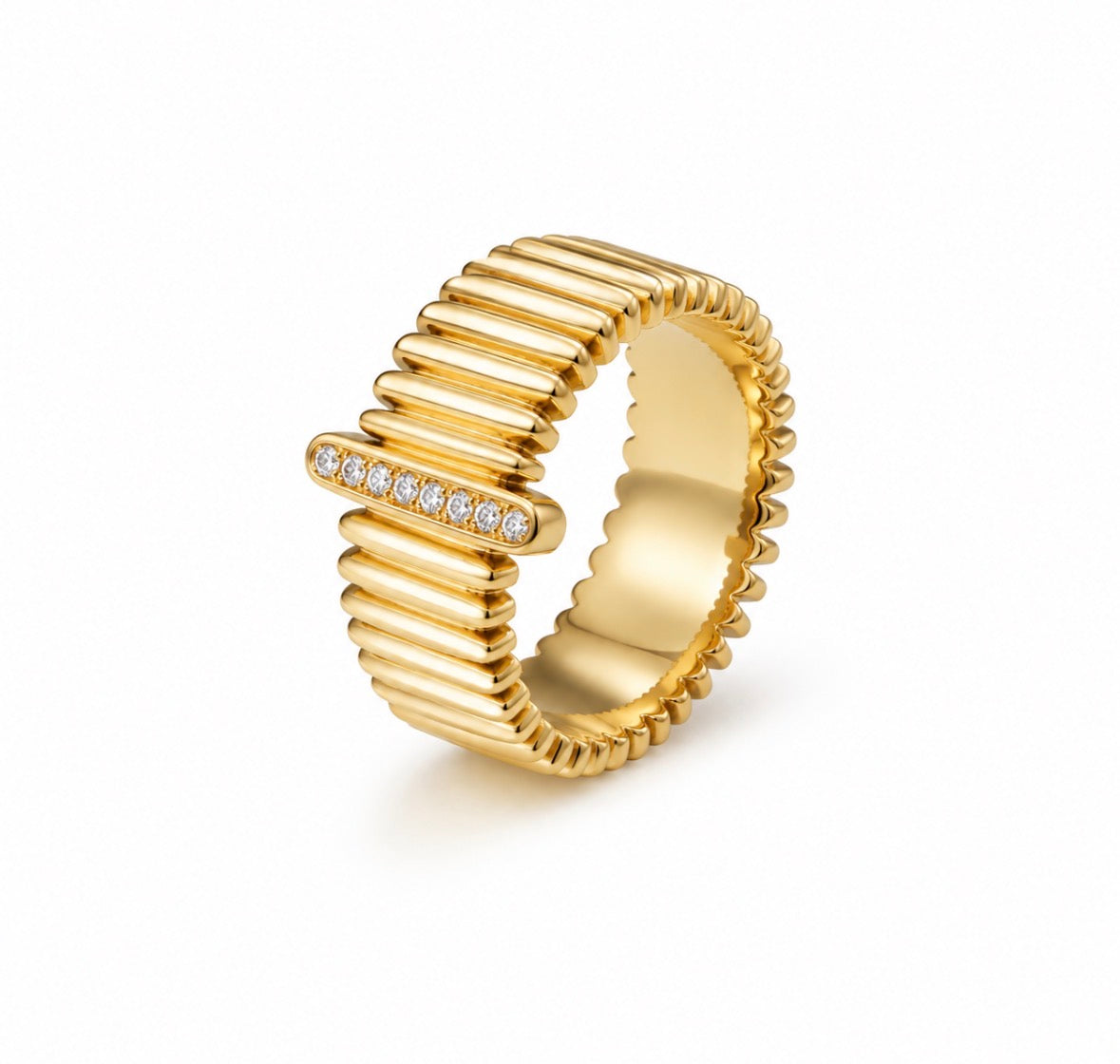 A gold ring with a ribbed, segmented design and a horizontal bar set with small clear stones, shown on a clean white background.