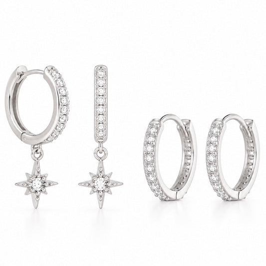 A set of silver-toned hoop earrings with clear pavé stones and dangling starburst charms, shown in multiple views on a white background.