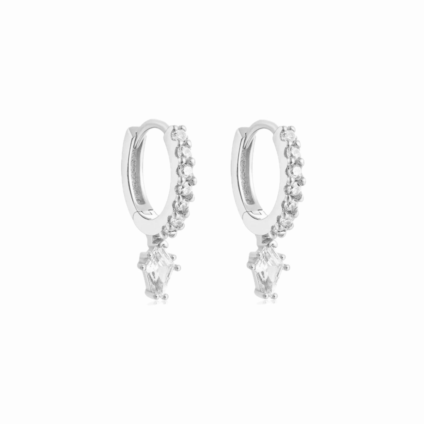 Pair of silver huggie hoop earrings with clear cubic zirconia hoop and diamond cubic zirconia stone drop. on a white background
