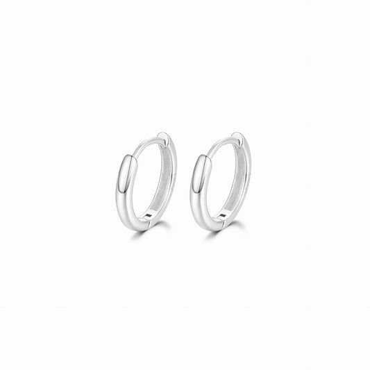 Pair of silver hoop earrings on a white background