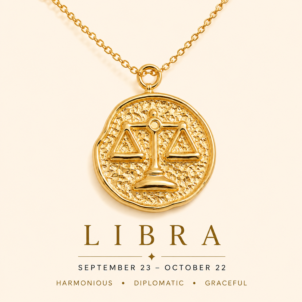 Gold Libra zodiac necklace on a beige background
