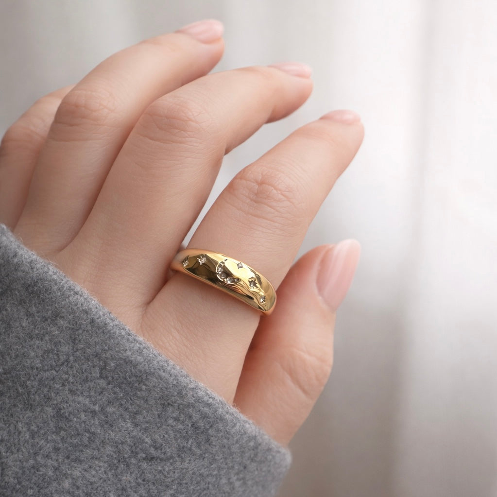 Gold ring on a finger with a blurred background