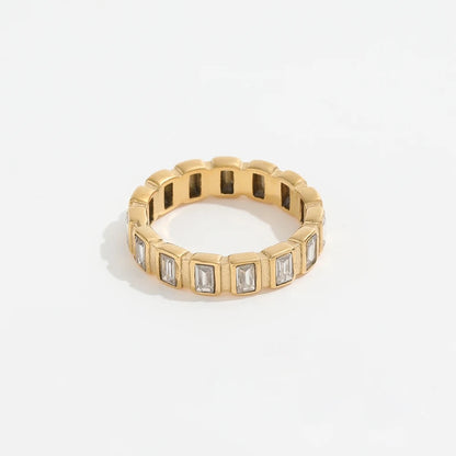 A gold-plated band ring with zirconia stones set around its circumference.