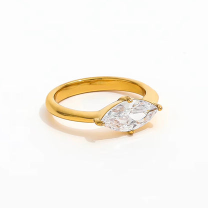 A yellow gold ring featuring a marquise-cut clear gemstone in a four-prong setting, photographed on a clean white background.