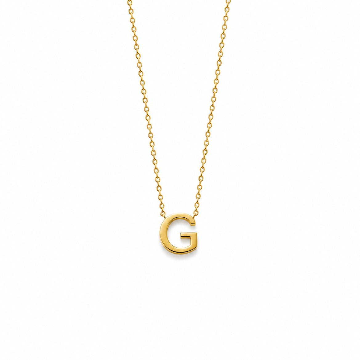 A delicate gold chain necklace featuring a polished gold initial pendant 'G', displayed against a solid white background.