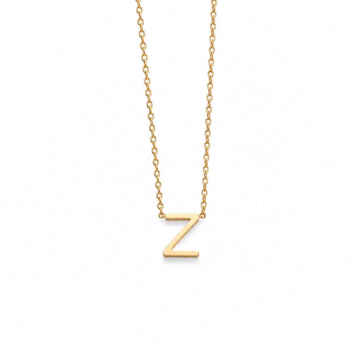 A delicate gold chain necklace featuring a polished, block-style capital letter 'Z' pendant, shown against a plain white background.