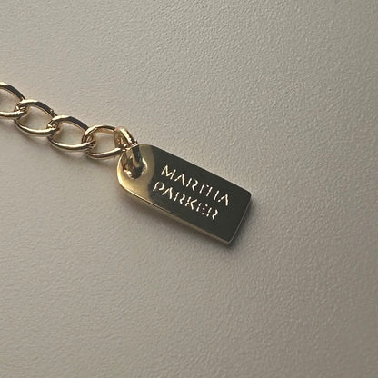 shows branding tag 'martha parker' at end of necklace 