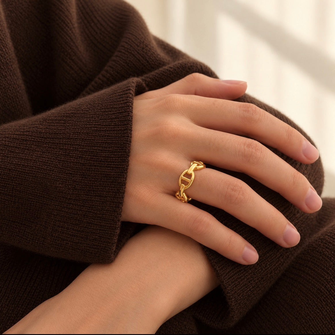 model wearing gold linked openwork band ring 