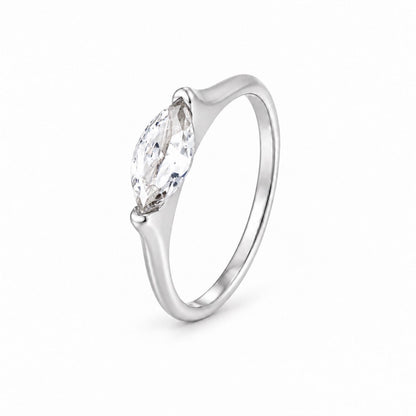 A silver ring featuring a marquise-cut clear gemstone in a prong setting, shown on a clean white background.