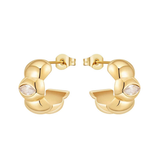 A pair of gold statement hoop earrings with a textured, rounded bubble design and a small marquise-cut clear gemstone on each earring, shown against a plain white background.