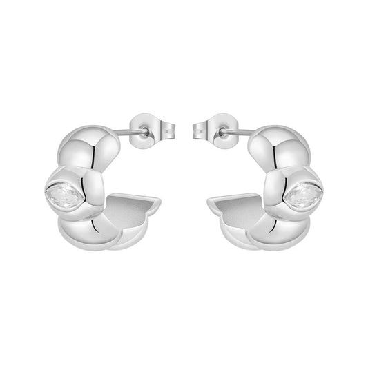 A pair of polished silver huggie hoop earrings with a small marquise-cut clear gemstone on each side, displayed against a solid white background.