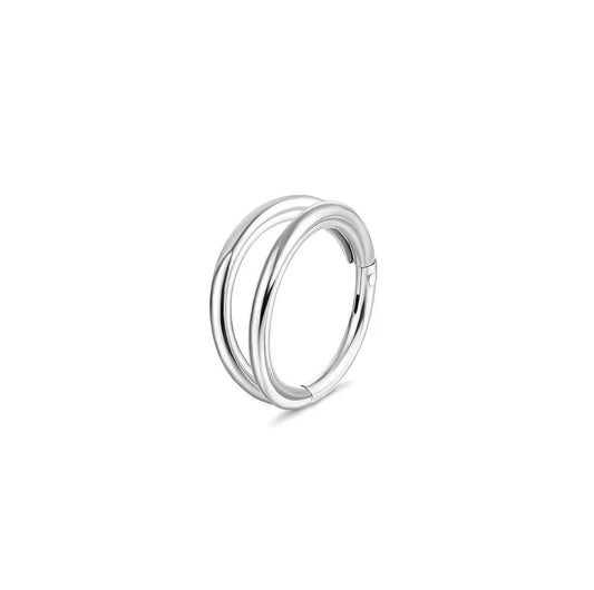 Silver double ring seamless clicker hoop on a white background