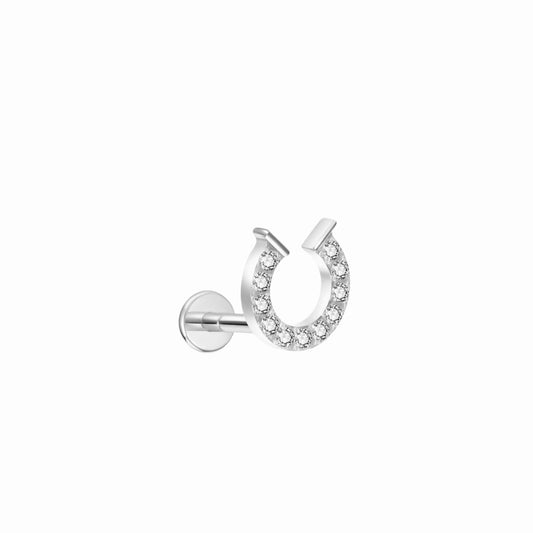 Gold horseshoe labret stud earring  on a white background