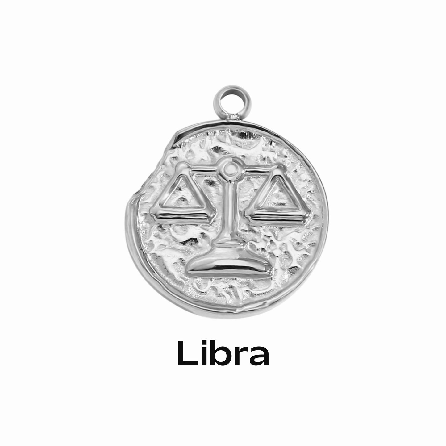 A silver coin-shaped pendant necklace with an engraved zodiac symbol