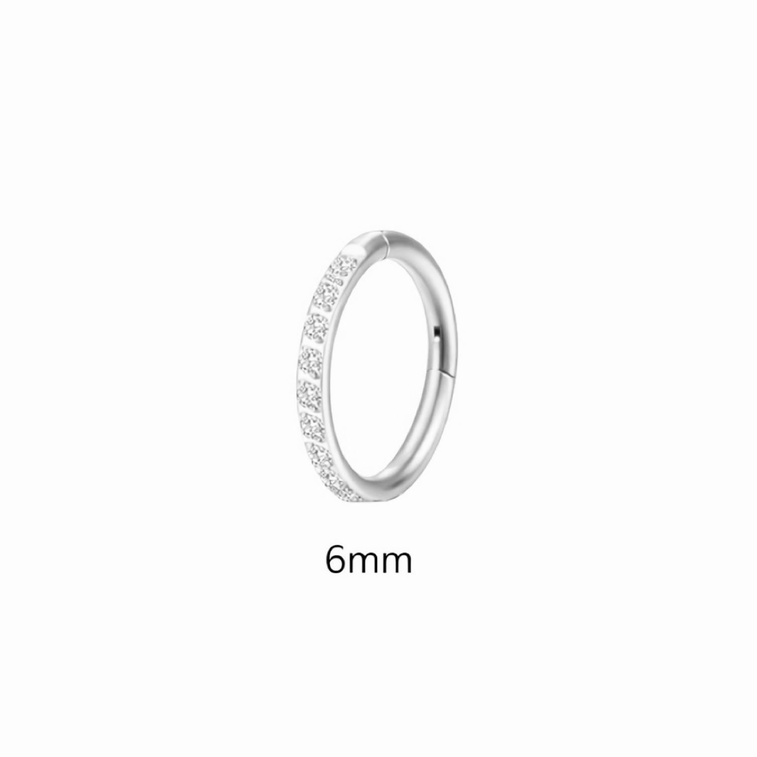 Silver ring with small diamonds on a white background